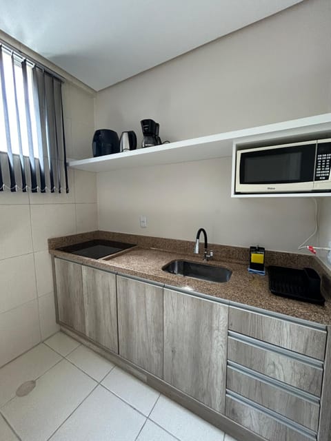 Kitchen or kitchenette, microwave, stove