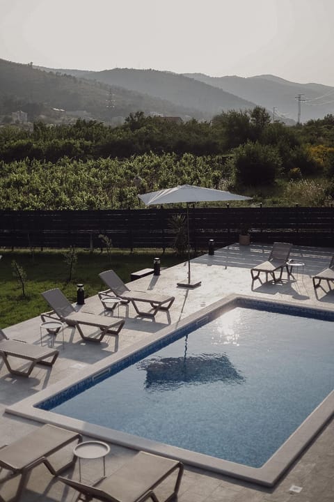 Swimming pool, sunbed