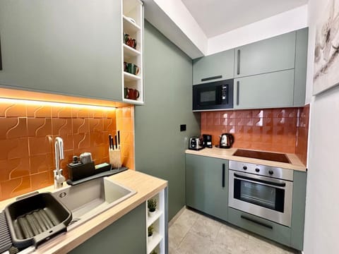 Kitchen or kitchenette, dishwasher, oven, stove, toaster