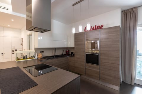 Kitchen or kitchenette, dishwasher, oven, stove