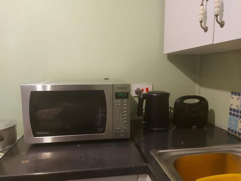 Kitchen or kitchenette, oven, toaster
