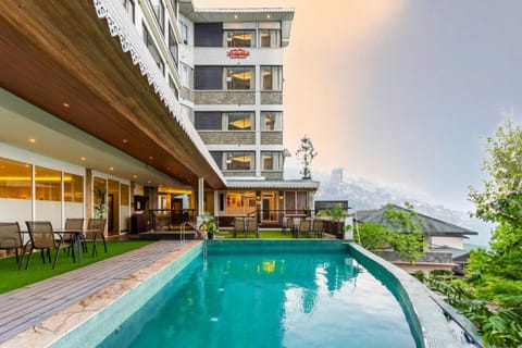 Property building, Day, Pool view, Swimming pool, sunbed
