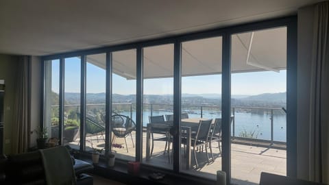 View (from property/room), Balcony/Terrace, Living room, Seating area, Dining area, Lake view, Mountain view