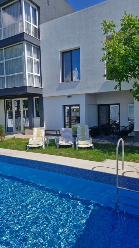 Property building, Day, Pool view, sunbed