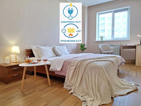 Bed, Photo of the whole room, Bedroom, Text overlay, towels