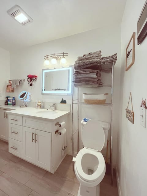 Shower, Toilet, Bathroom, bidet, hair dryier, towels, towels, dryer, air conditioner