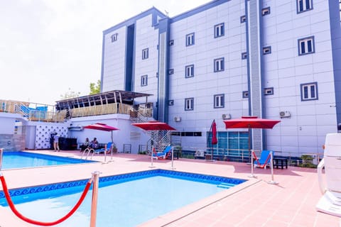 Property building, Pool view, Swimming pool, sunbed