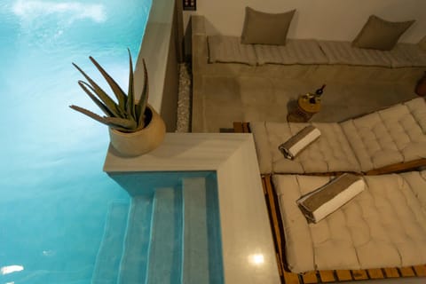 Property building, Living room, Seating area, Pool view, Swimming pool, sunbed