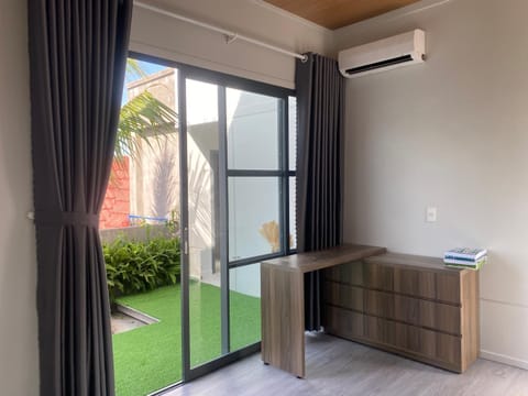 Patio, Living room, Seating area, Garden view, air conditioner