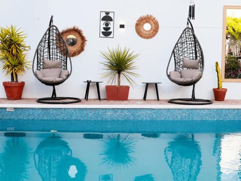 Patio, Day, Living room, Seating area, Pool view, Swimming pool, sunbed