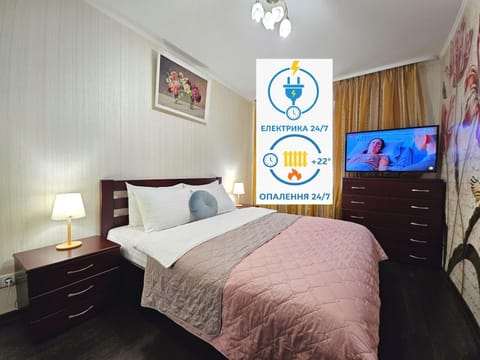 Bed, Property logo or sign, TV and multimedia, Photo of the whole room, Logo/Certificate/Sign, Bedroom, Text overlay, Certificate/Award, internet, internet