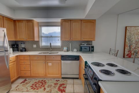 Kitchen or kitchenette, dishwasher, oven, stove, toaster