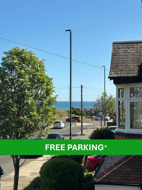 Neighbourhood, Text overlay, Sea view, Street view, Parking