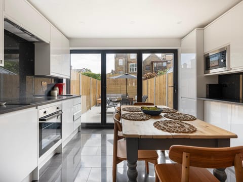 Kitchen or kitchenette, Seating area, Dining area, dishwasher, oven, stove