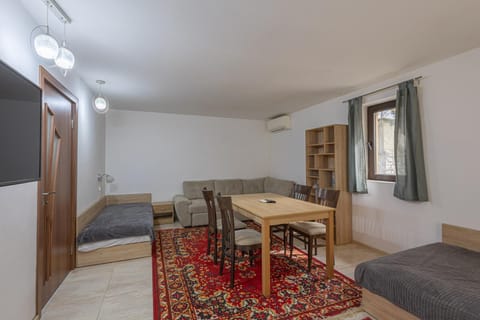 Bed, TV and multimedia, Living room, Photo of the whole room, Seating area, Dining area, internet, air conditioner