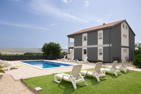 Property building, Patio, Natural landscape, Pool view, Swimming pool, sunbed