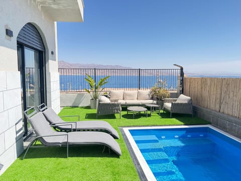 Property building, Patio, Natural landscape, View (from property/room), Balcony/Terrace, Sea view, Swimming pool, sunbed