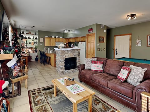 Billiard, Kitchen or kitchenette, Living room, Seating area, fireplace, furniture, air conditioner