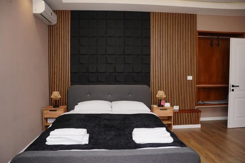 Bed, Photo of the whole room, Bedroom, towels, air conditioner