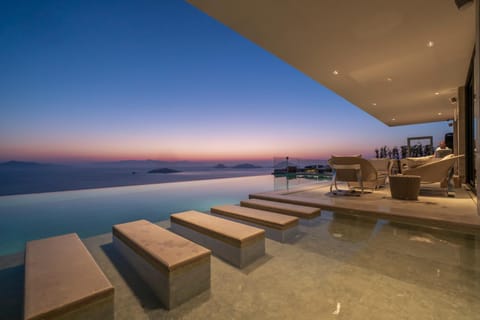 View (from property/room), Seating area, Pool view, Sea view, Swimming pool, Sunset, sunbed