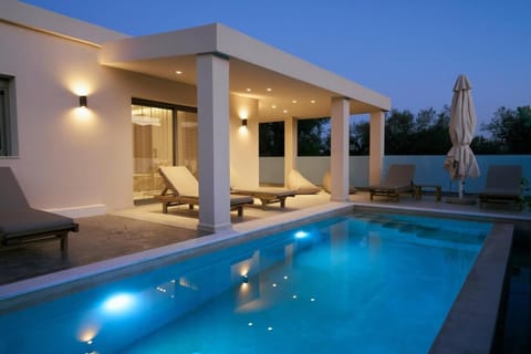 Property building, Patio, Night, Natural landscape, Pool view, Swimming pool, sunbed