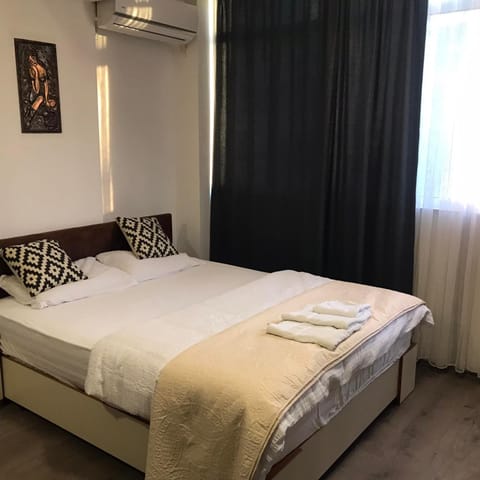Bed, Photo of the whole room, Bedroom, towels, air conditioner