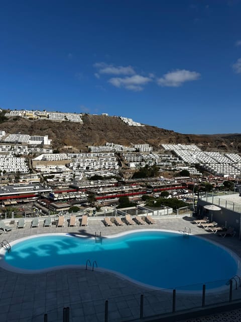 Property building, Nearby landmark, Day, Natural landscape, City view, Mountain view, Pool view, Swimming pool