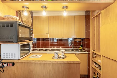 Kitchen or kitchenette, locker, microwave, oven, stove, kitchen