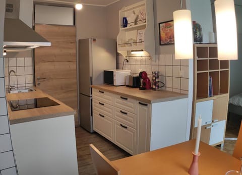Kitchen or kitchenette, dishwasher, oven, stove