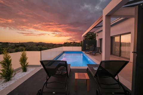 View (from property/room), Swimming pool, Sunset