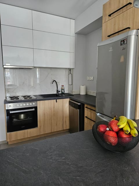 Kitchen or kitchenette, dishwasher, oven, stove