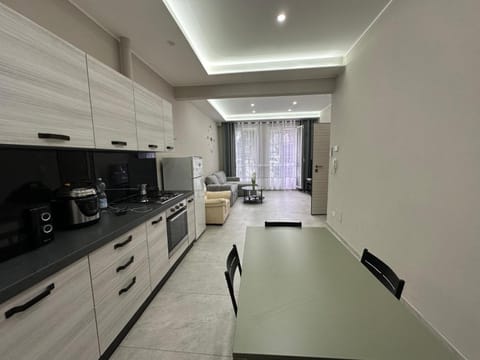 Kitchen or kitchenette, dishwasher, oven, stove