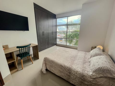 Bed, TV and multimedia, Photo of the whole room, Decorative detail, Seating area, Bedroom, flat iron, hair dryier, trouser press, wardrobe, air conditioner
