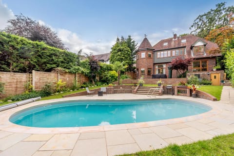 Property building, Patio, Spring, Day, Natural landscape, Garden, Garden view, Pool view, Swimming pool