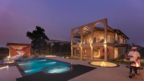 Property building, Patio, Staff, Staff, Night, People, Pool view, Swimming pool