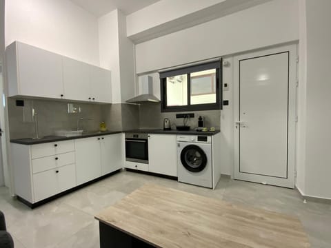 Kitchen or kitchenette, oven, stove, toaster, washing machine