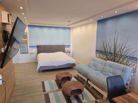 Moderne Wohnung mit Sonnenuntergang über dem Meer Apartment in Heiligenhafen