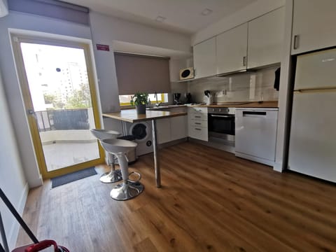 Kitchen or kitchenette, dishwasher, oven, stove, toaster
