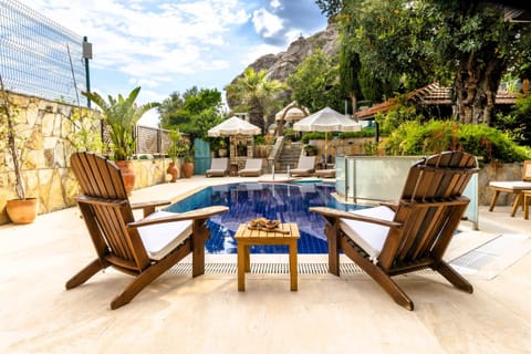 Patio, Day, Natural landscape, Pool view, Swimming pool, sunbed