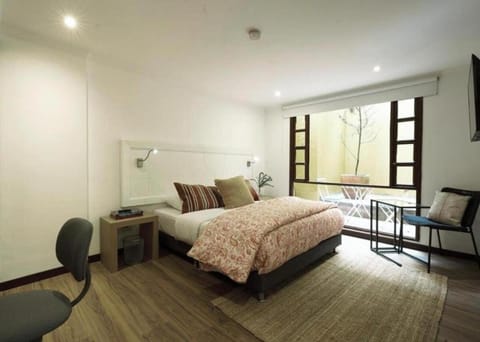 Patio, Bed, TV and multimedia, Photo of the whole room, Seating area, Bedroom