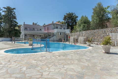 Property building, Living room, Swimming pool