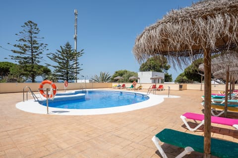 Property building, Living room, Swimming pool