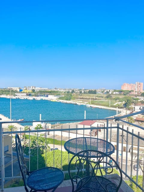 Patio, Nearby landmark, Day, Natural landscape, Snorkeling, View (from property/room), Balcony/Terrace, Dining area, Beach, Text overlay, City view, Sea view, ATM, bidet, hair dryier, internet, internet, towels, towels, laundry, elevator