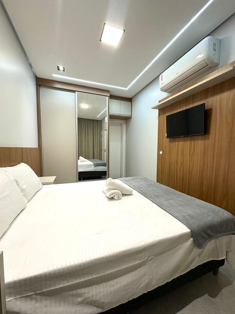 Bed, towels, wardrobe, air conditioner