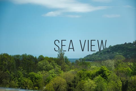 Nearby landmark, Day, Natural landscape, Text overlay, Sea view
