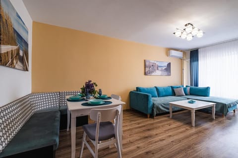 View (from property/room), Living room, Decorative detail, Seating area, Dining area, furniture, air conditioner