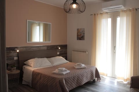 Bed, Photo of the whole room, Bedroom, towels, air conditioner