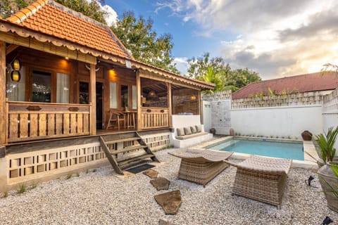 Property building, Patio, Day, Natural landscape, Pool view, Swimming pool, sunbed