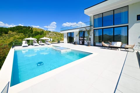 Patio, Day, Natural landscape, Pool view, Swimming pool, sunbed