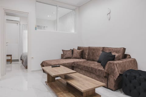 Bed, TV and multimedia, Living room, Seating area, air conditioner